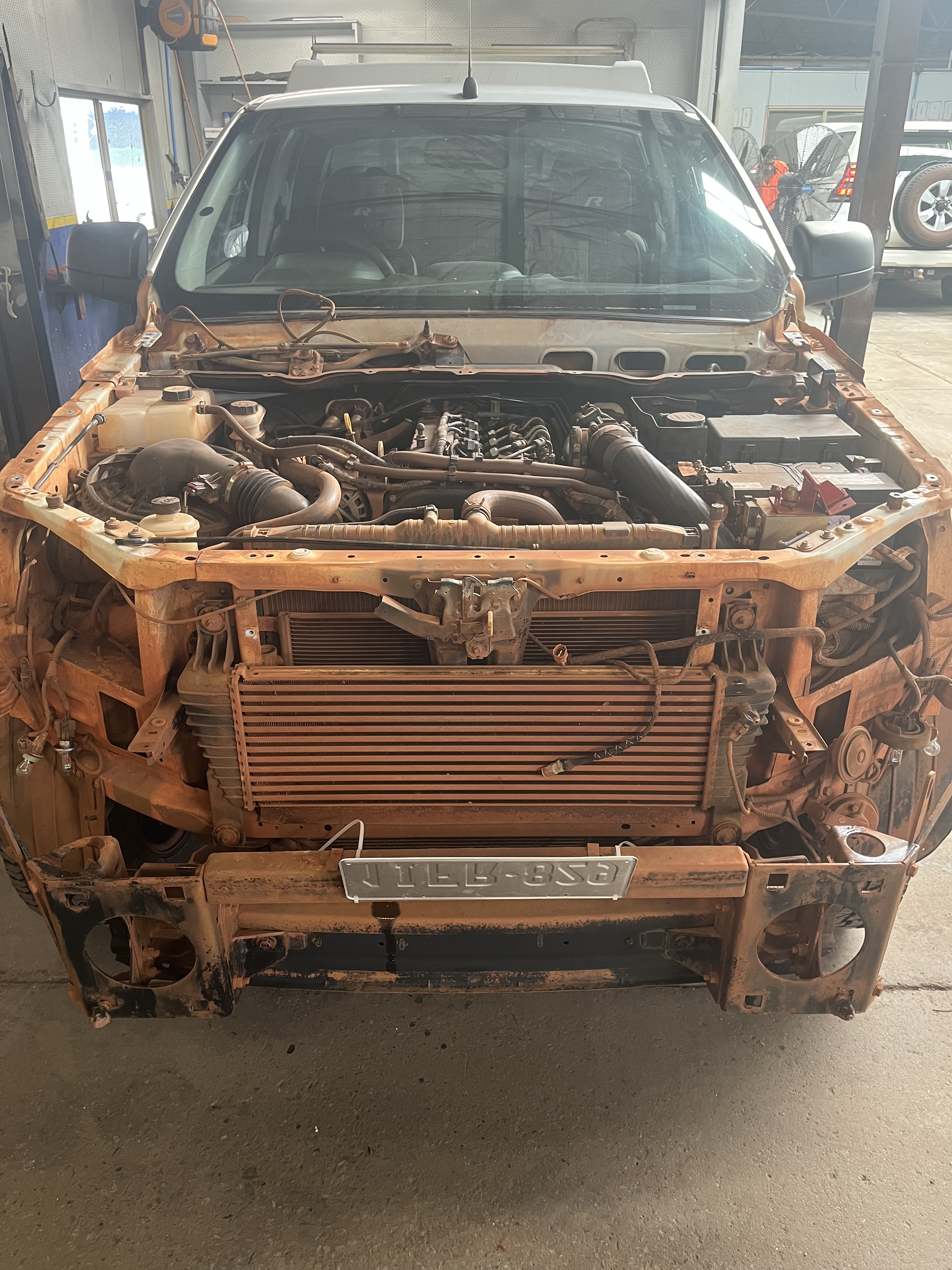 Ex-mining vehicle restoration Perth - professional restoration service showing stripped engine bay